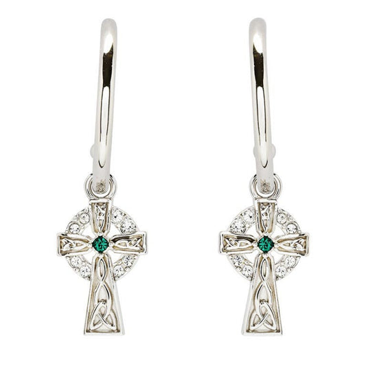 A pair of sterling silver hoop earrings with a Celtic cross design and green cubic zirconia at the center.