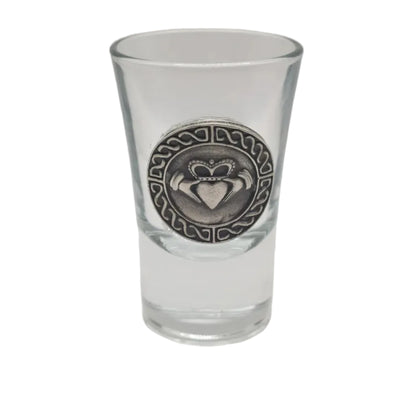 Clear shot glass with a pewter claddagh emblem with a celtic knotwork border