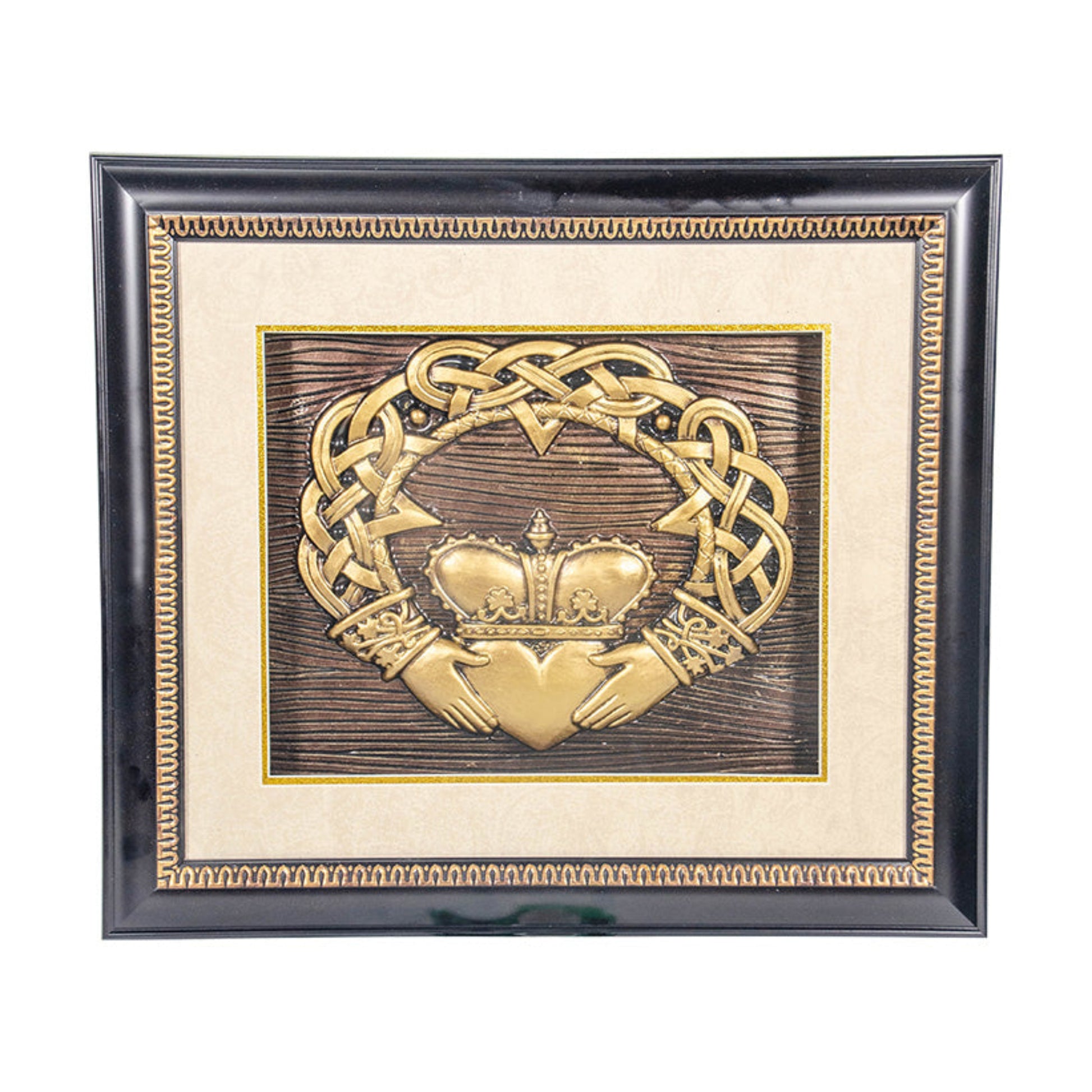 Decorative plaque with Claddagh design and crown in a black frame on a white background
