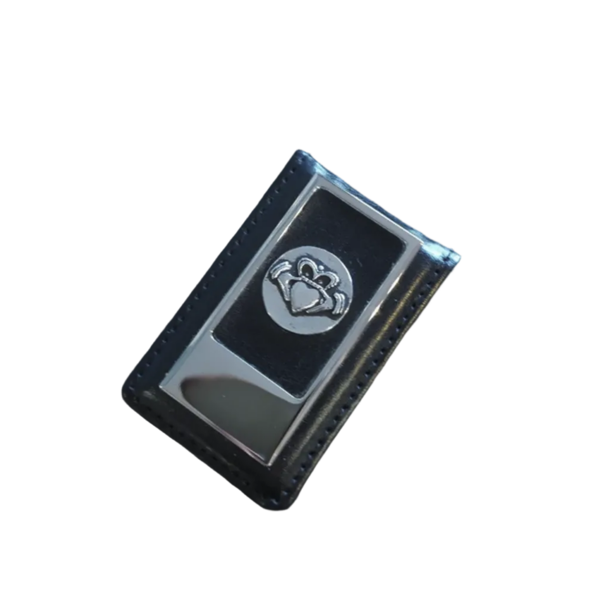 Black money clip with a silver-colored claddagh emblem on the top.