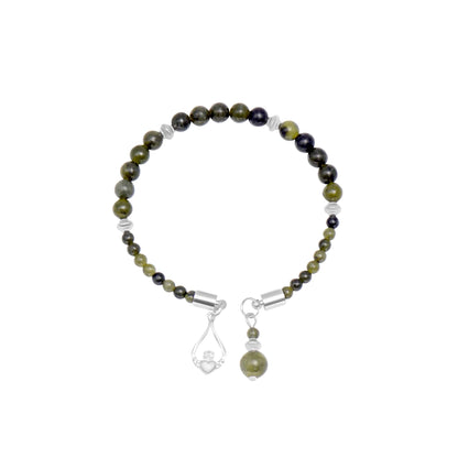 Beaded bracelet with green and black stones on a white background