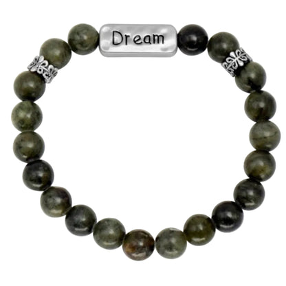 Green beaded bracelet with a charm that says "dream"