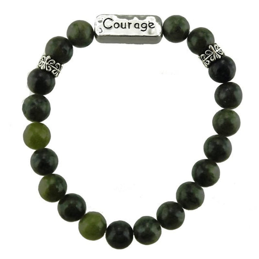 Green beaded bracelet with silver charms on a white background