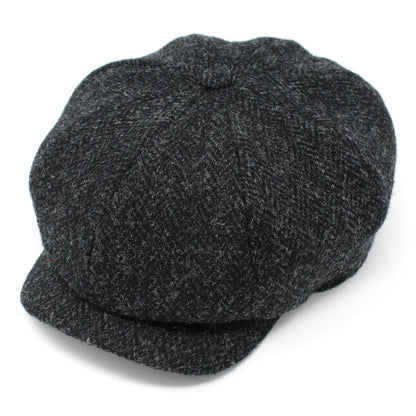 Dark gray newsboy cap on a white background
