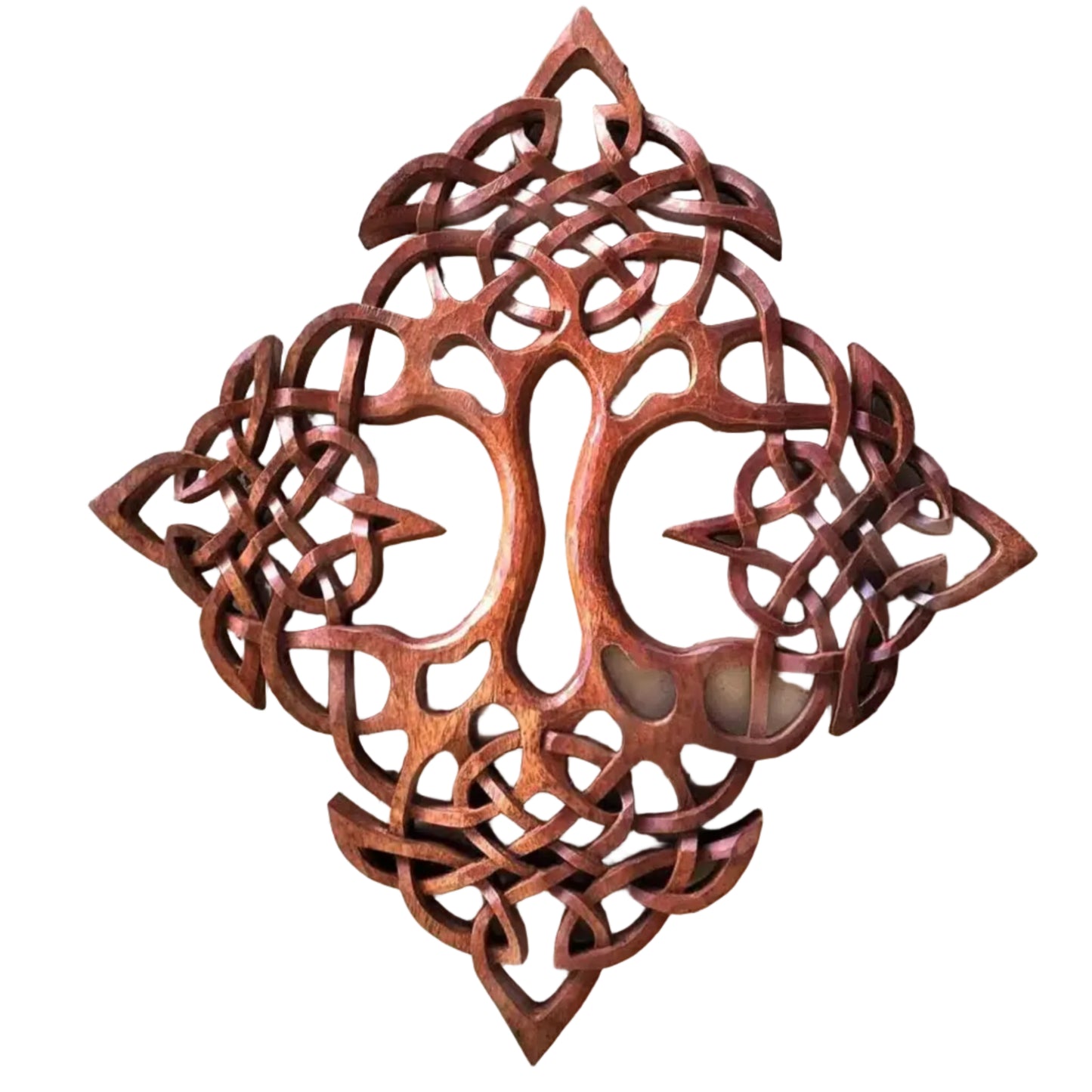A hand-carved wooden sculpture of the Tree of Life with intricate cut-out patterns.