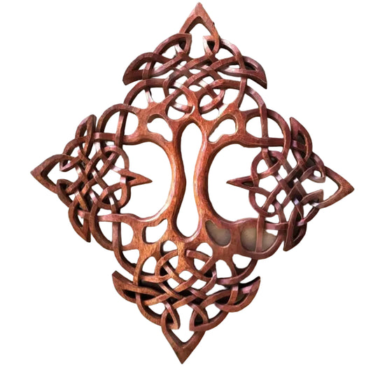 A hand-carved wooden sculpture of the Tree of Life with intricate cut-out patterns.