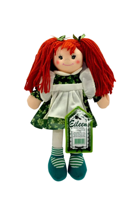 A doll with red hair, wearing a green and white dress and green and white striped shoes, with a tag showing the name 'Eileen'.