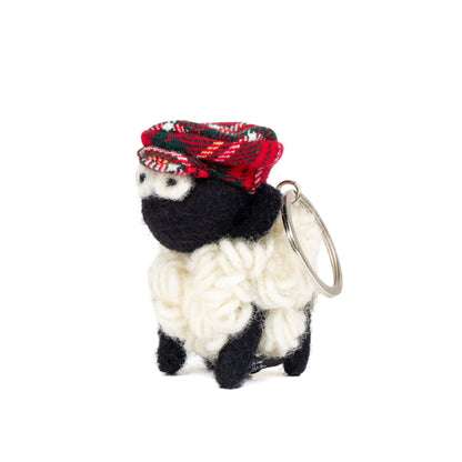 Wool sheep keyring with a red flat cap