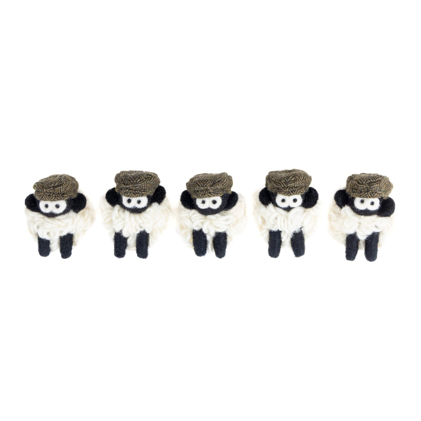 Five small knit sheep with brown flat caps