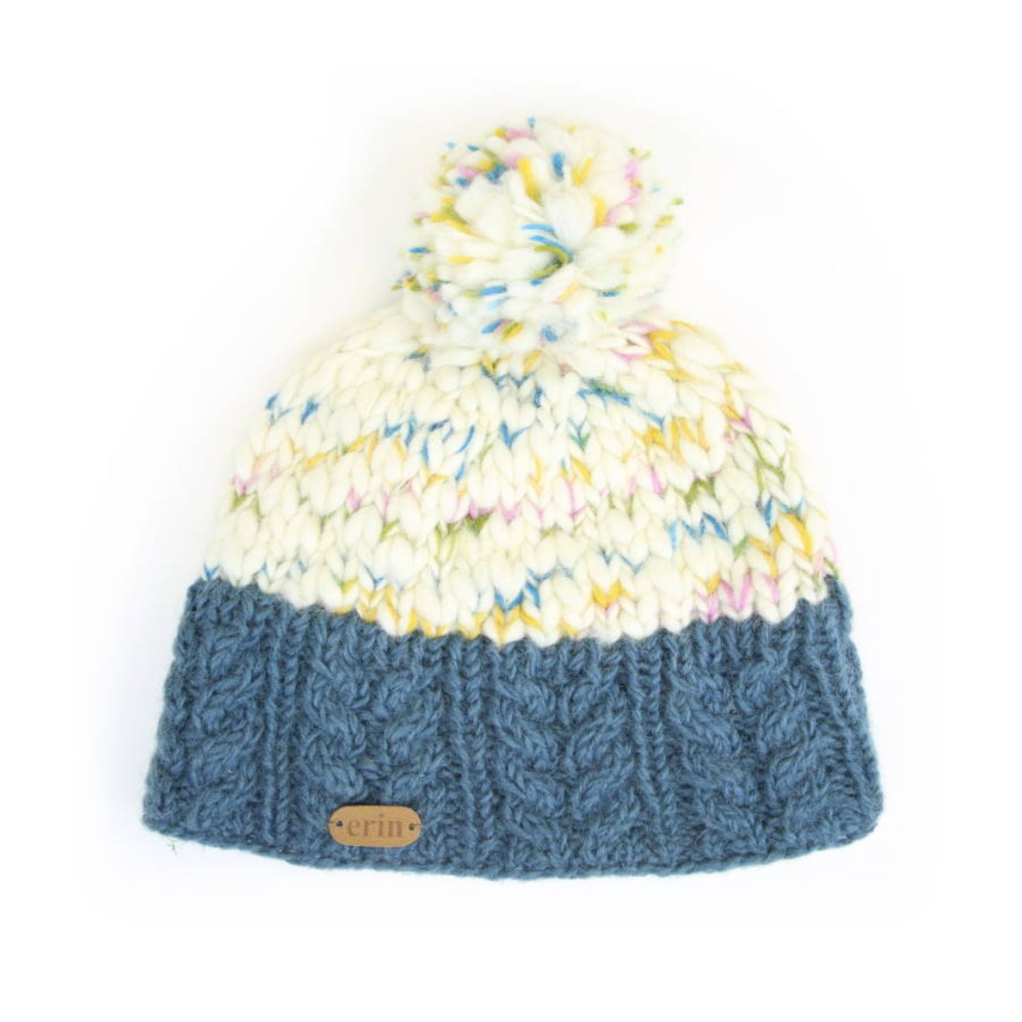 A knit hat with a blue bottom and colorful flecks throughout the top. Flecked bobble on top.
