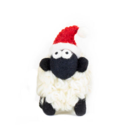 Knitted sheep figurine with felt santa hat.