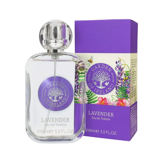 A clear bottle of Lavender perfume with a purple logo next to a purple, floral-patterned box. 