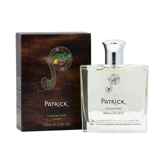 A clear, square bottle of cologne next to a brown box that says "patrick" with a large logo. 