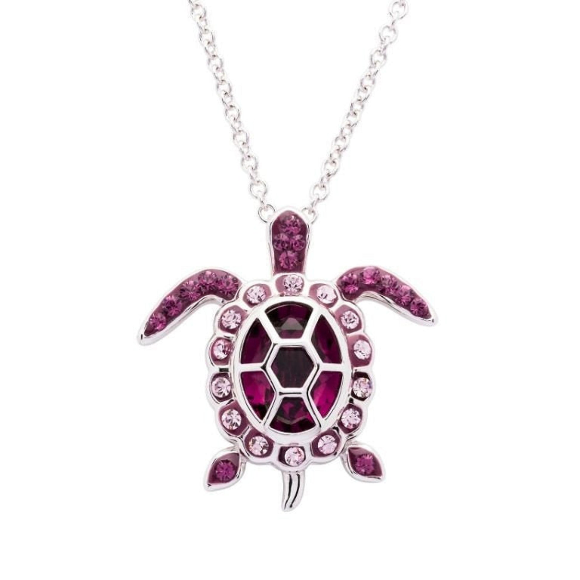 Turtle-shaped necklace with pink gemstones on a white background