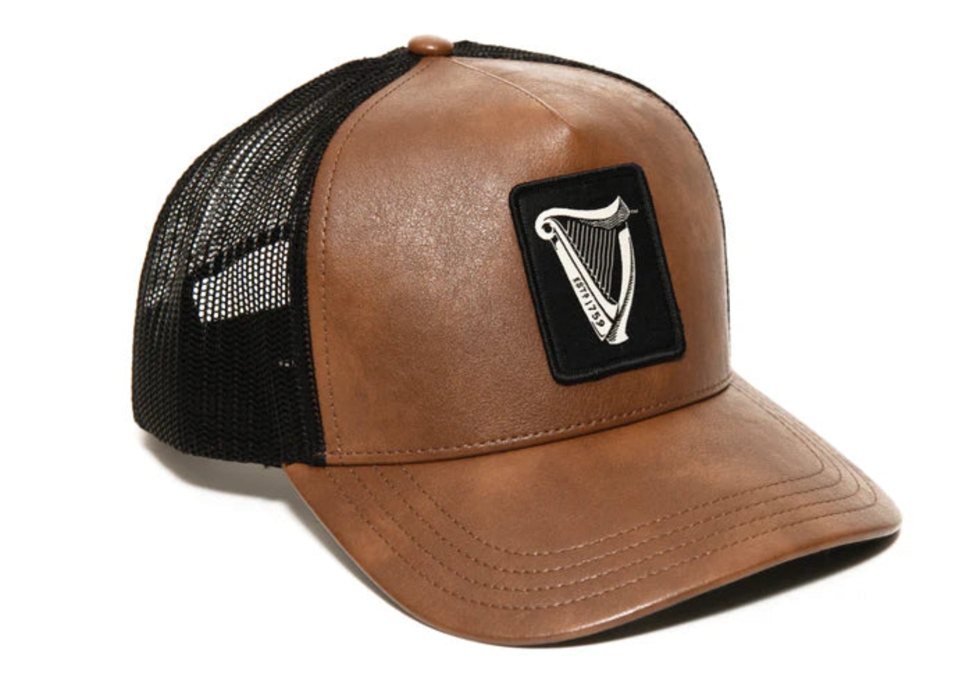 Brown leather trucker cap with black mesh back and a Guinness harp logo patch on a white background
