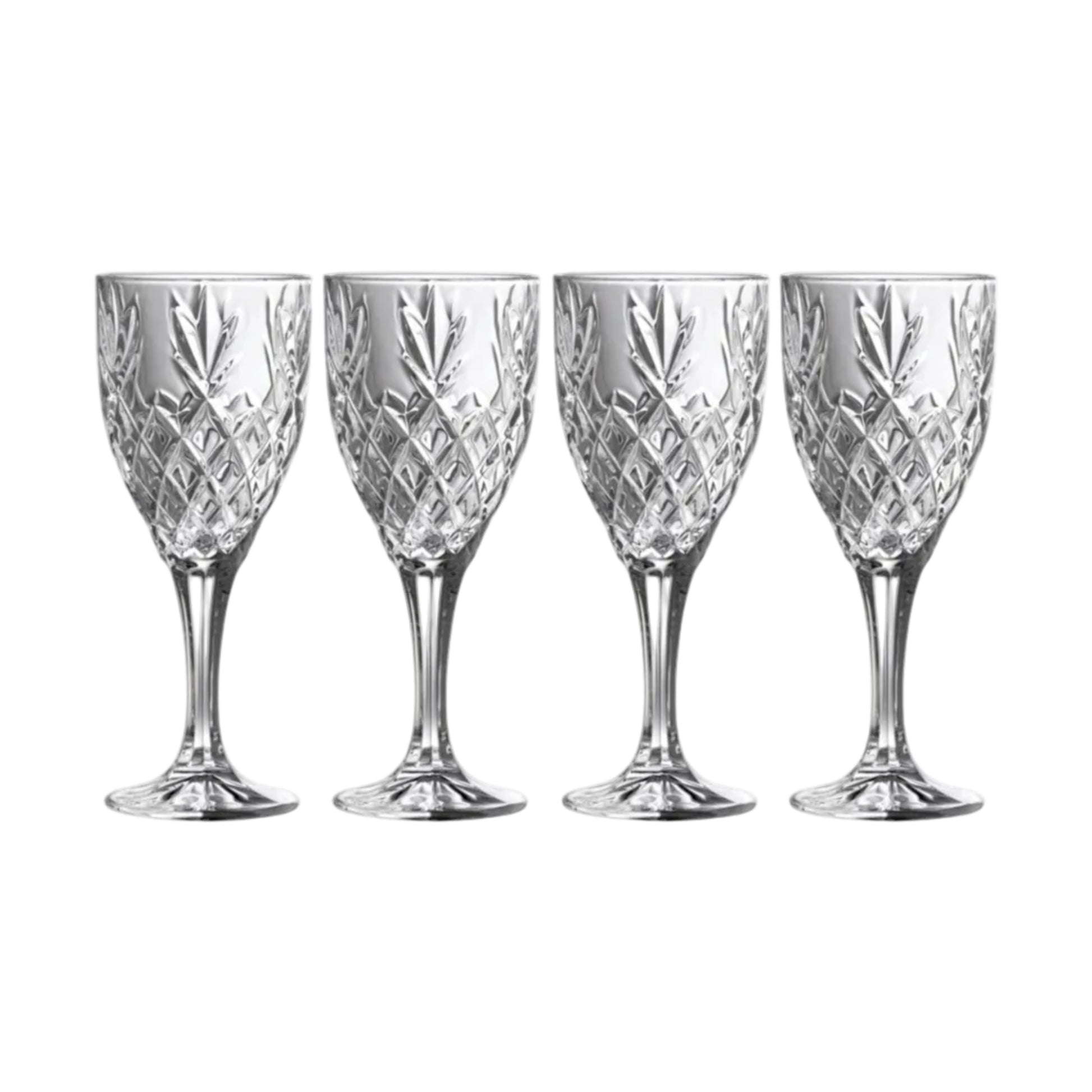 Four crystal wine glasses with cut patterns on a white background