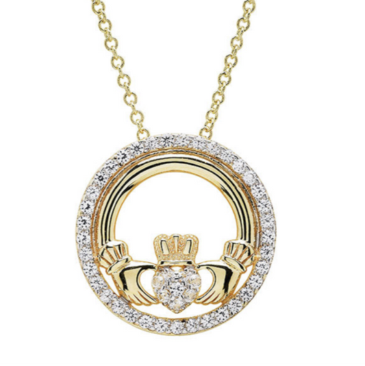 Gold Claddagh pendant necklace on a white background