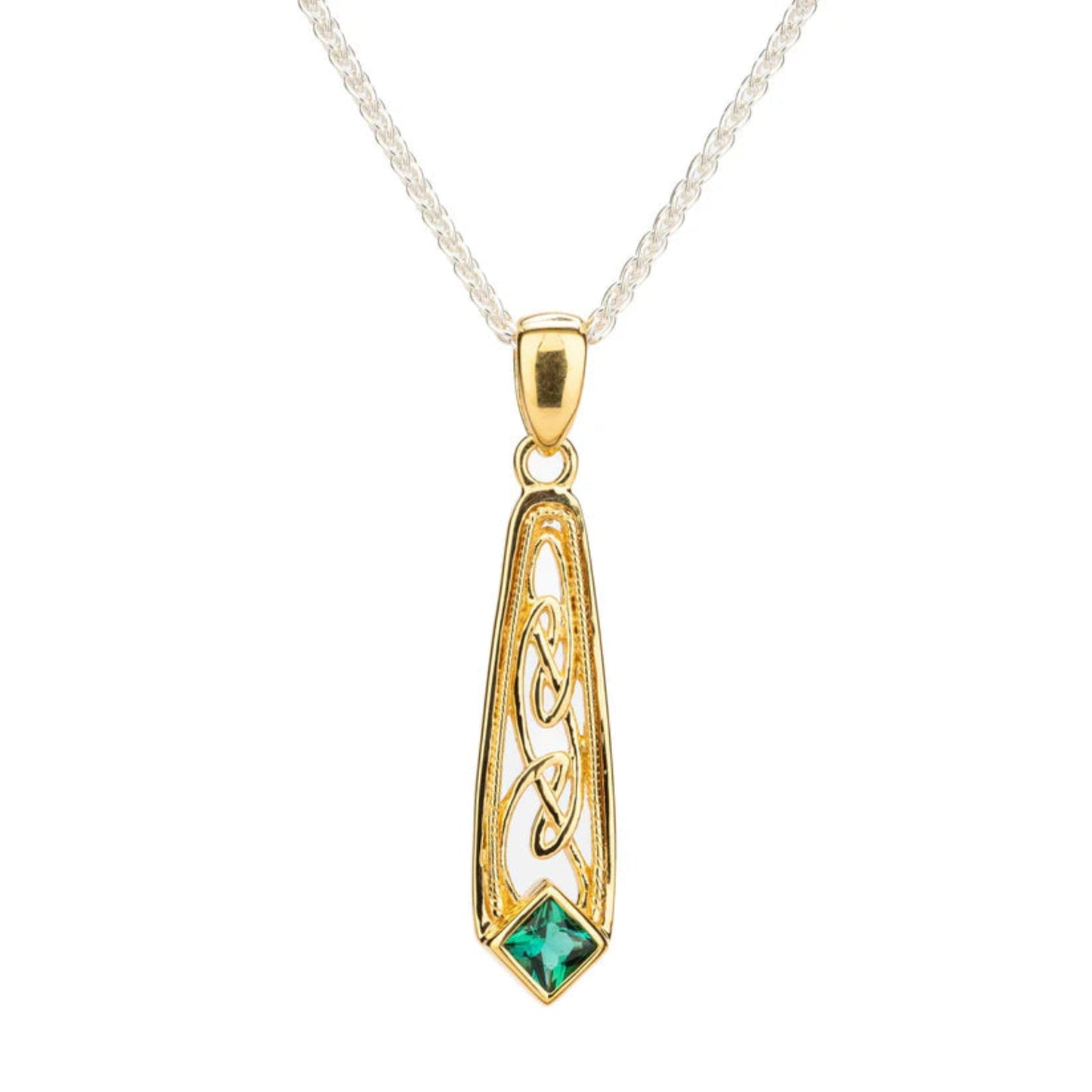 Gold pendant with green gemstone on a white background