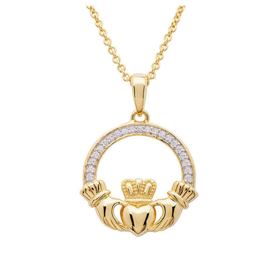 Gold Claddagh pendant necklace on a white background