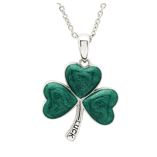 Green shamrock pendant with 'LUCK' on a silver chain against a white background