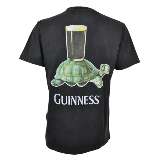 The back of a t-shirt with a graphic of a tortoise with a beer glass on its shell. "Guinness" is written underneath.