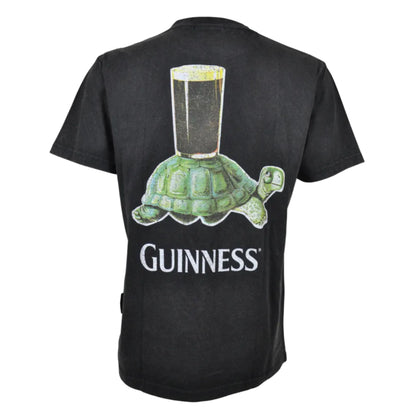 The back of a t-shirt with a graphic of a tortoise with a beer glass on its shell. "Guinness" is written underneath.