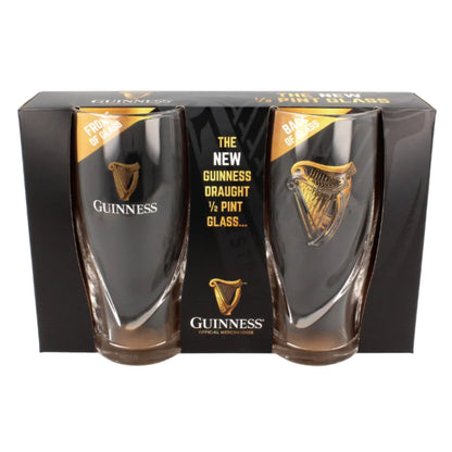 Two guinness beer glasses with harp logos encased in black cardboard packaging. 