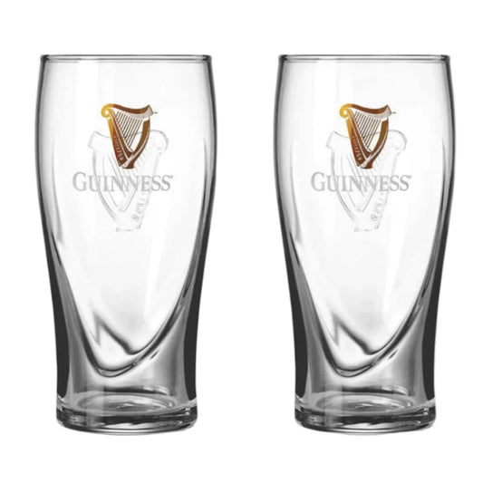Two clear Guinness beer glasses with harp logos and Guinness written on the front. 