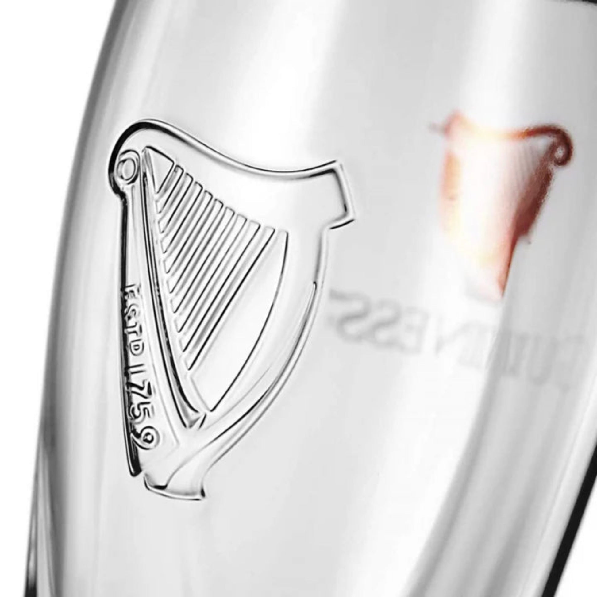 Close-up of a glass with a harp embossed on it that says "ESTD 1759."