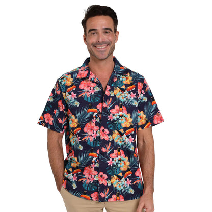 Smiling man wearing a colorful, floral toucan button-up. 