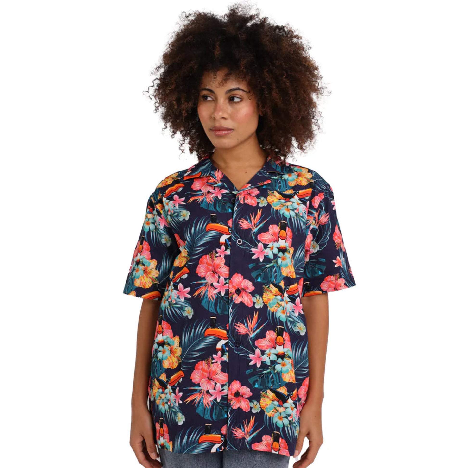 Woman wearing a colorful floral toucan button-up.