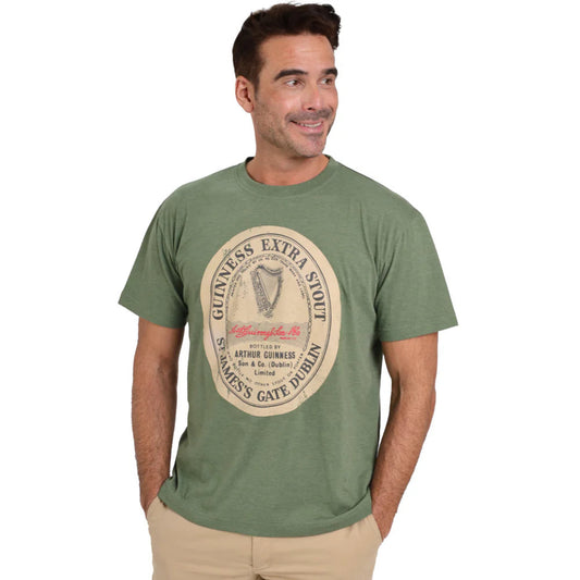 A man wearing a green short-sleeved crew neck t-shirt with a distressed Guinness label graphic.