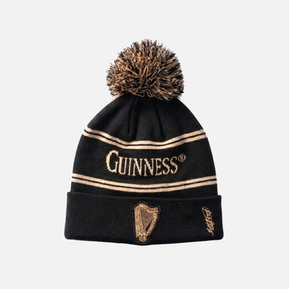 Black beanie with gold accents and 'Guinness' logo on a white background