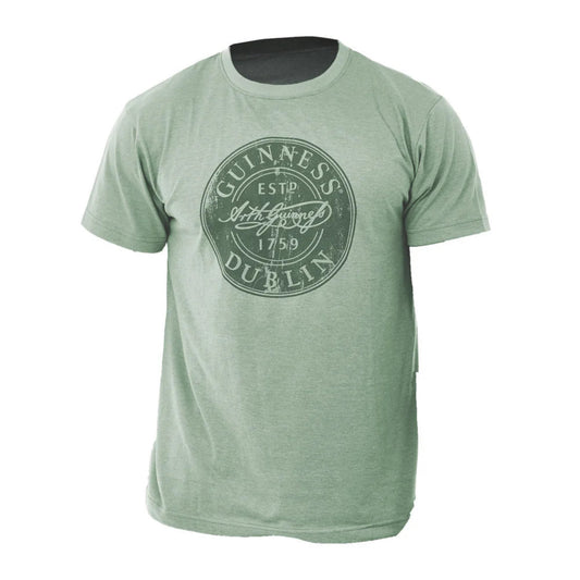 A light green heathered short-sleeve t-shirt with a distressed circular Guinness Dublin logo printed on the chest, displayed on a solid white background.