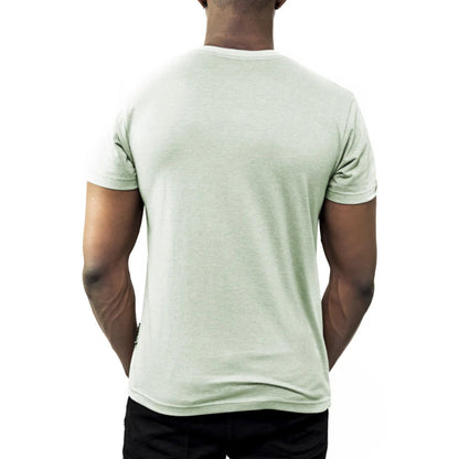 A man turned around to show the back of his light green tee shirt.