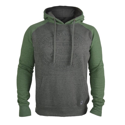 A raglan pullover hoodie with a dark heather gray body and olive green sleeves and hood lining, featuring a faded circular graphic on the chest and a front kangaroo pocket.
