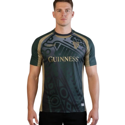 Man wearing a green and black sports jersey with 'Guinness' branding on a white background