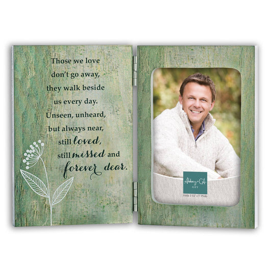 Memorial photo frame with a quote and a photo of a man in a white coat.