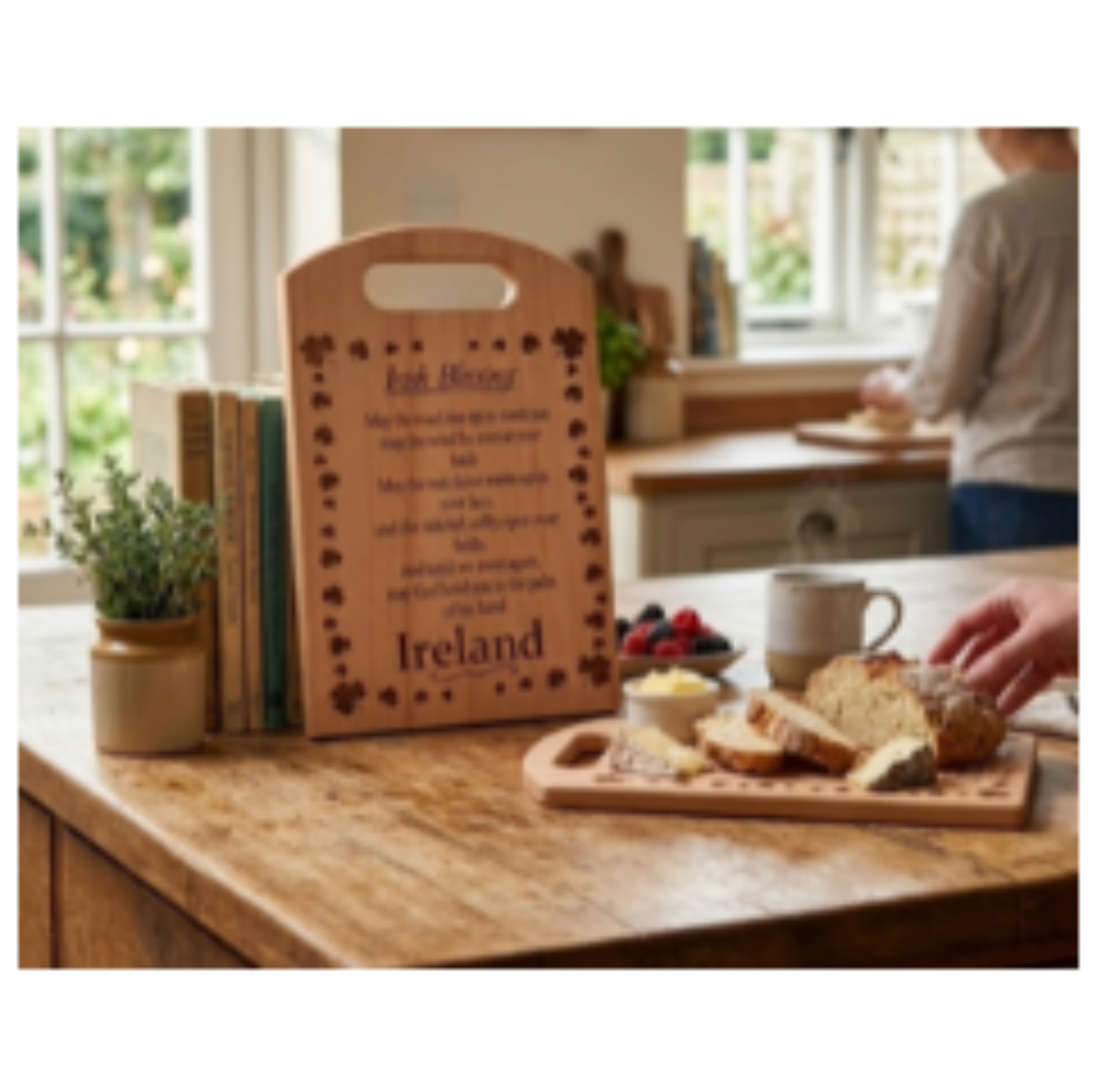Wooden cutting board with engraved text on a kitchen counter with bread and coffee.