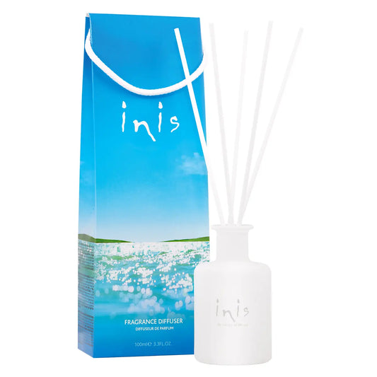 Inis Fragrance Diffuser packaging and diffuser with reeds inside the vessel, placed against a white background.