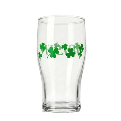 Clear glass with green shamrock design on a white background