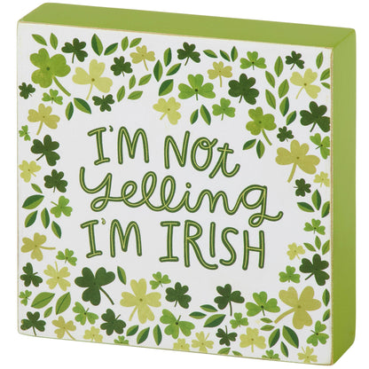 Decorative box with green shamrock pattern and text 'I'm not yelling I'm Irish' on a white background.