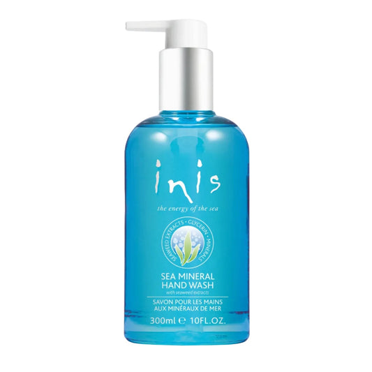A blue bottle of Inis hand soap with a white pump top and white text