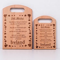 Two wooden signs with engraved text and clover designs on a white background