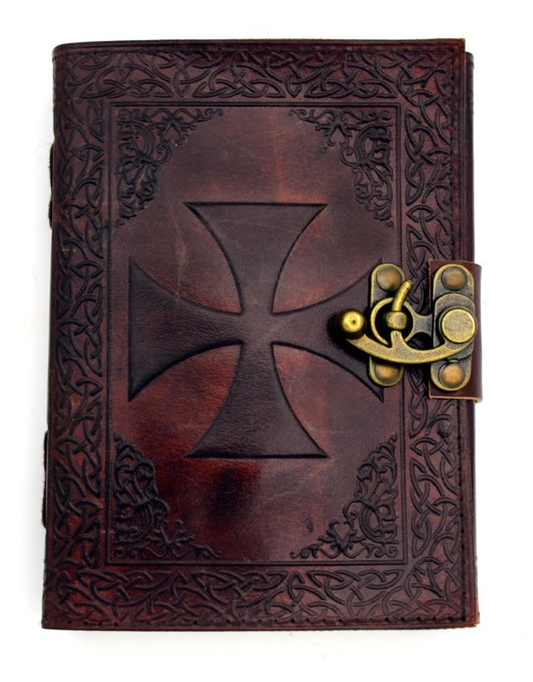 Decorative leather journal with cross design and gold clasp on a white background