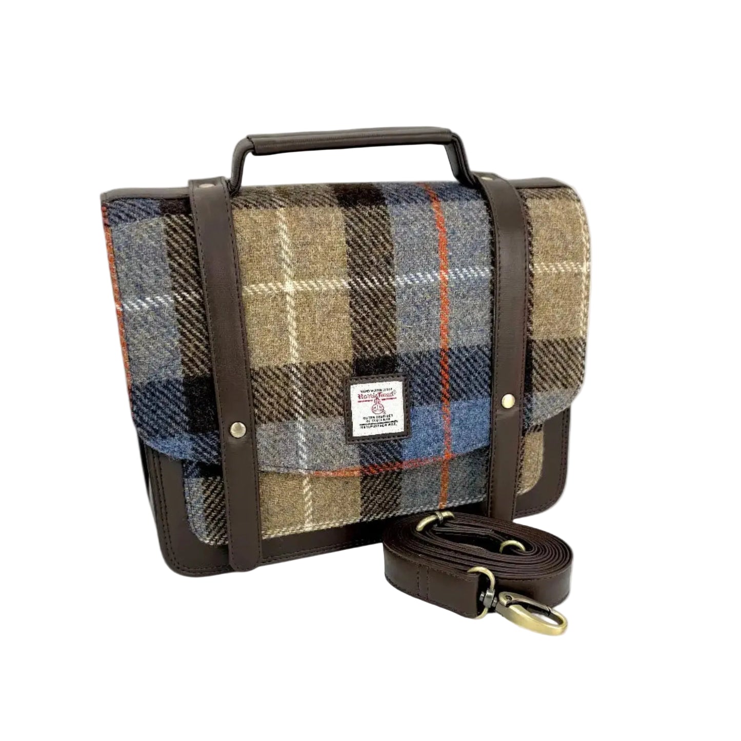 Plaid bag with brown leather straps on a white background