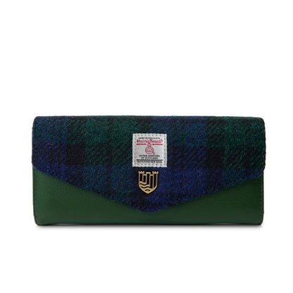 Green and blue plaid wallet with a brand label on a white background