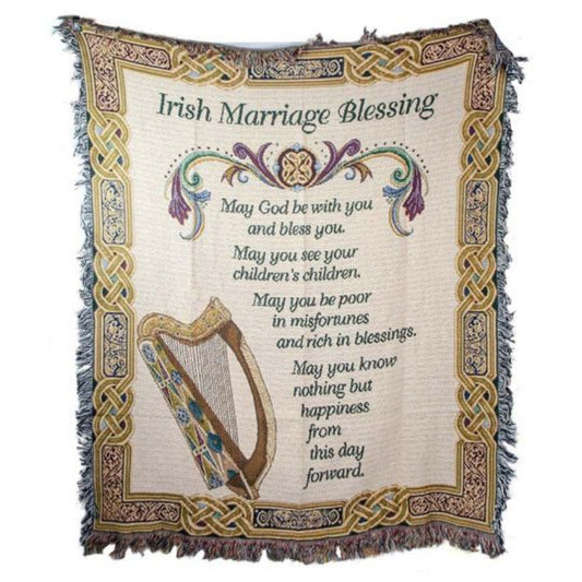 A throw blanket with Celtic knot borders and a harp design in the center, featuring an Irish Marriage Blessing text.