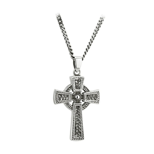 A sterling silver oxidised Celtic cross pendant attached to a curb chain necklace.