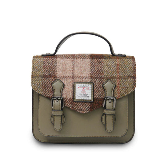 Handbag with plaid top section and green base on a white background